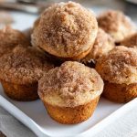 Cinnamon Muffins with cinnamon sugar topping, served on a white plate.