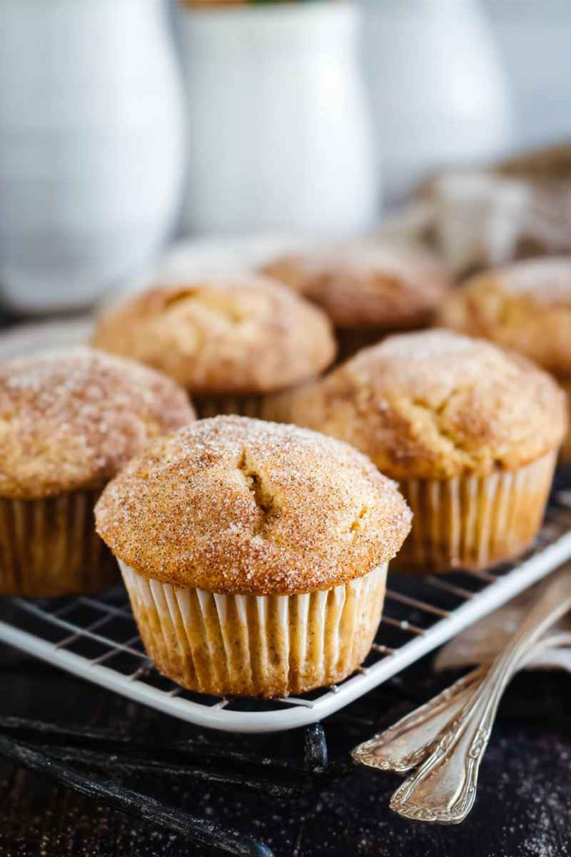 A tray of freshly baked Cinnamon Sugar Muffins cooling on a wire rack, ready to be enjoyed.