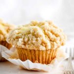 Golden-yellow lemon muffin topped with a crumbly streusel.