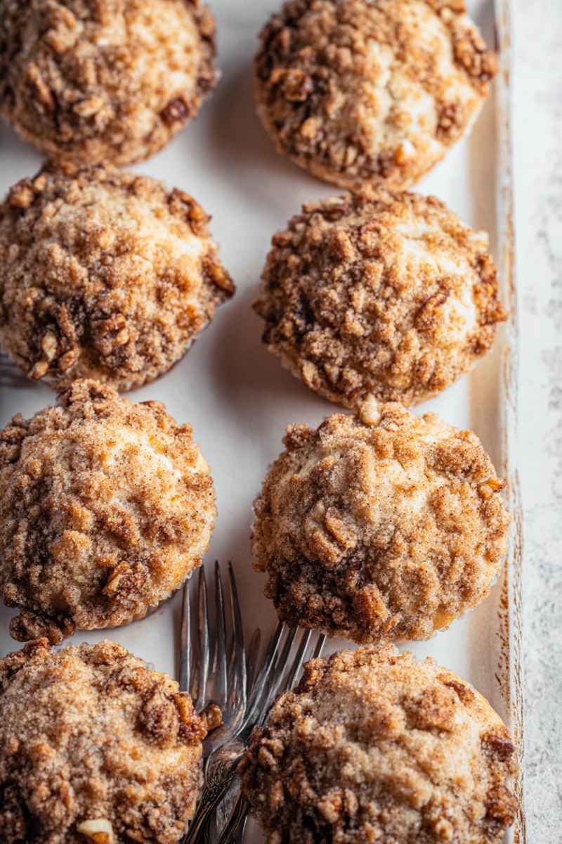 A tray of banana muffins with streusel topping, ready to be enjoyed as a delicious snack or dessert.