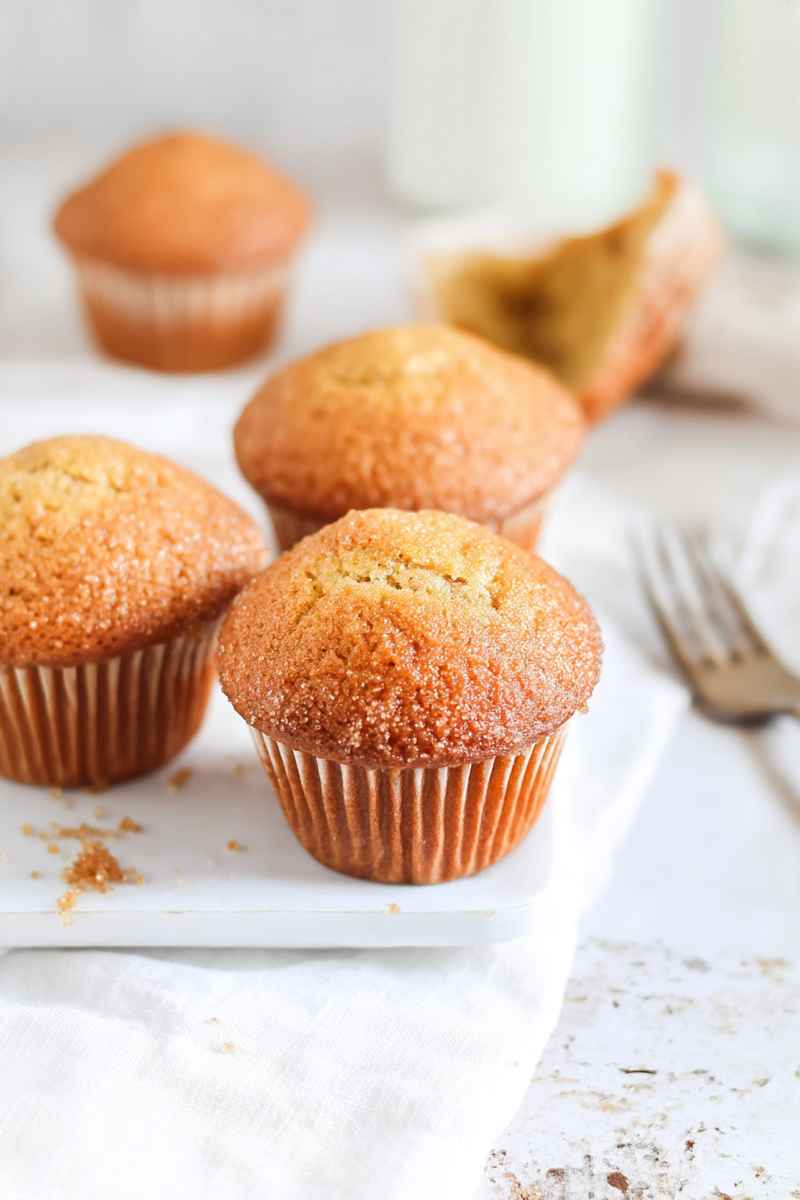 Plump brown sugar muffins dusted with cinnamon sugar, ready to be enjoyed.